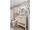 Bathroom featuring a white vanity and medicine cabinet with neutral paint at 6724 E Spring Lake Rd, Mooresville, IN 46158