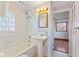 Bright bathroom with pedestal sink, bathtub and shower combo at 6724 E Spring Lake Rd, Mooresville, IN 46158
