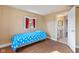 Bedroom featuring hardwood floors, natural light, and an adjoining bathroom at 6724 E Spring Lake Rd, Mooresville, IN 46158