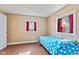 Bedroom with laminate wood flooring and two bright windows at 6724 E Spring Lake Rd, Mooresville, IN 46158
