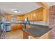 Kitchen featuring stainless steel appliances, wooden cabinets and breakfast bar at 6724 E Spring Lake Rd, Mooresville, IN 46158