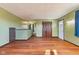 Living room with hardwood floors, neutral paint, and closet doors at 6724 E Spring Lake Rd, Mooresville, IN 46158