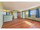 Living room with hardwood floors, neutral paint, and large windows at 6724 E Spring Lake Rd, Mooresville, IN 46158