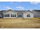 Back exterior of home features multiple windows providing lots of natural light at 7091 Lillian Pl, Cumberland, IN 46229