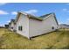 Back exterior of home features multiple windows providing lots of natural light at 7091 Lillian Pl, Cumberland, IN 46229