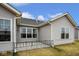 Back exterior of home features multiple windows providing lots of natural light at 7091 Lillian Pl, Cumberland, IN 46229