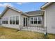 Back exterior of home features multiple windows providing lots of natural light at 7091 Lillian Pl, Cumberland, IN 46229