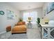 Comfortable bedroom with natural light, stylish decor, and a soft chaise lounge at 7091 Lillian Pl, Cumberland, IN 46229