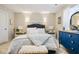Inviting bedroom with a comfortable bed, dresser, and natural lighting at 7091 Lillian Pl, Cumberland, IN 46229