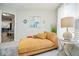 Cozy bedroom featuring a comfortable chaise lounge, soft carpet, and bright natural light at 7091 Lillian Pl, Cumberland, IN 46229