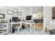 Home office open to the living area; features a desk, storage, and bright natural light at 7091 Lillian Pl, Cumberland, IN 46229