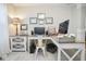 Well-lit home office with a corner desk, storage cabinet, and inspirational decor at 7091 Lillian Pl, Cumberland, IN 46229