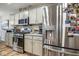 Updated kitchen with stainless steel appliances and granite countertops at 7091 Lillian Pl, Cumberland, IN 46229