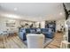 Spacious living space showcasing an open layout with seamless flow between living, dining, and kitchen areas at 7091 Lillian Pl, Cumberland, IN 46229