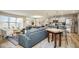 Bright living space with open floor plan connecting the living room, dining area, and modern kitchen at 7091 Lillian Pl, Cumberland, IN 46229