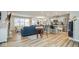 Inviting living space with an open layout, seamlessly blending the living room, dining area, and kitchen at 7091 Lillian Pl, Cumberland, IN 46229