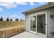 Private patio with a view of the tree line beyond at 7091 Lillian Pl, Cumberland, IN 46229