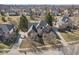 Aerial view of a brick home featuring a large yard, mature trees, and a long driveway at 7238 River Birch Ln, Indianapolis, IN 46236