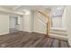 Finished basement with open staircase and wood-look flooring at 7238 River Birch Ln, Indianapolis, IN 46236