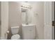 Powder room with a white vanity, mirror, and neutral wall color at 7238 River Birch Ln, Indianapolis, IN 46236