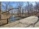 Scenic bridge over the creek, with wooden planks and secure railings for a safe and nature-filled experience at 7238 River Birch Ln, Indianapolis, IN 46236