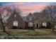 Charming home with a well-maintained lawn, mature trees and a front entry with sidelights at 7238 River Birch Ln, Indianapolis, IN 46236