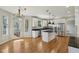 Modern kitchen with stainless steel appliances, white cabinets, and a center island at 7238 River Birch Ln, Indianapolis, IN 46236