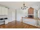 Living room with hardwood floors, a fireplace, and built-in shelving at 7238 River Birch Ln, Indianapolis, IN 46236