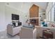 Bright living room featuring a brick fireplace, built-in shelving, and comfortable seating at 7238 River Birch Ln, Indianapolis, IN 46236