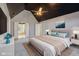 This spacious main bedroom features a vaulted ceiling, a ceiling fan, and neutral decor at 7238 River Birch Ln, Indianapolis, IN 46236