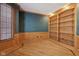 Office with hardwood floors, custom bookshelves, and bay windows at 7238 River Birch Ln, Indianapolis, IN 46236
