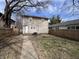 Backyard featuring a fenced in yard, walkway, and back door at 749 W 32Nd St, Indianapolis, IN 46208