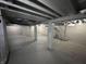 Unfinished basement with exposed ceiling, concrete floor, and support pillars at 749 W 32Nd St, Indianapolis, IN 46208