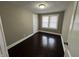 Bedroom featuring hardwood floors, natural lighting, and neutral-colored walls at 749 W 32Nd St, Indianapolis, IN 46208