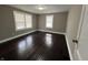 Bedroom featuring hardwood floors, natural lighting, and neutral-colored walls at 749 W 32Nd St, Indianapolis, IN 46208