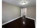 Neutral bedroom featuring hardwood floors and an open door at 749 W 32Nd St, Indianapolis, IN 46208