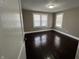 Bedroom featuring hardwood floors, natural lighting, and neutral-colored walls at 749 W 32Nd St, Indianapolis, IN 46208