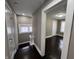 Hallway with hardwood floors featuring a view of an adjacent bedroom through an open doorway at 749 W 32Nd St, Indianapolis, IN 46208
