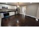 Updated kitchen featuring stainless steel appliances, white cabinetry, and seamless access to the adjacent rooms at 749 W 32Nd St, Indianapolis, IN 46208