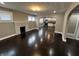 Bright living room boasts hardwood floors, a charming fireplace, and an open layout leading into the adjacent kitchen at 749 W 32Nd St, Indianapolis, IN 46208