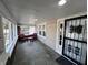 Inviting screened-in porch featuring a seating area, offering a cozy spot to relax and enjoy the outdoors at 749 W 32Nd St, Indianapolis, IN 46208