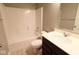 Well-maintained bathroom with a tub, shower, single sink vanity, and neutral decor at 8105 Milender Blvd, Indianapolis, IN 46237