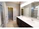 Bright bathroom features a double sink vanity, a walk-in closet, and a glass-enclosed shower at 8105 Milender Blvd, Indianapolis, IN 46237