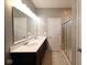 This bright bathroom is equipped with a double sink vanity and a large walk-in shower at 8105 Milender Blvd, Indianapolis, IN 46237