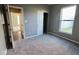Bedroom features soft carpeting, closet for storage, and large window for ample natural light at 8105 Milender Blvd, Indianapolis, IN 46237
