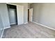 Neutral bedroom with carpet, closet, and grey walls at 8105 Milender Blvd, Indianapolis, IN 46237