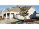Attractive home featuring a two-car garage, covered porch, and mature landscaping at 8105 Milender Blvd, Indianapolis, IN 46237