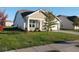 Well-manicured lawn enhances the curb appeal of this home with a two-car garage at 8105 Milender Blvd, Indianapolis, IN 46237