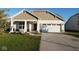 Charming single-Gathering home featuring a two-car garage and well-maintained front yard at 8105 Milender Blvd, Indianapolis, IN 46237