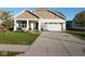 Charming single-story home with attached two-car garage and manicured front lawn at 8105 Milender Blvd, Indianapolis, IN 46237